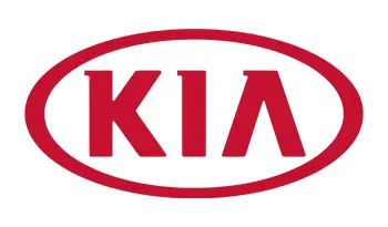 A red kia logo is shown on the side of a car.